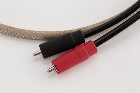 Close up of a used Chord Epic X 2RCA-DIN 1.0m Interconnect Cable showing connectors