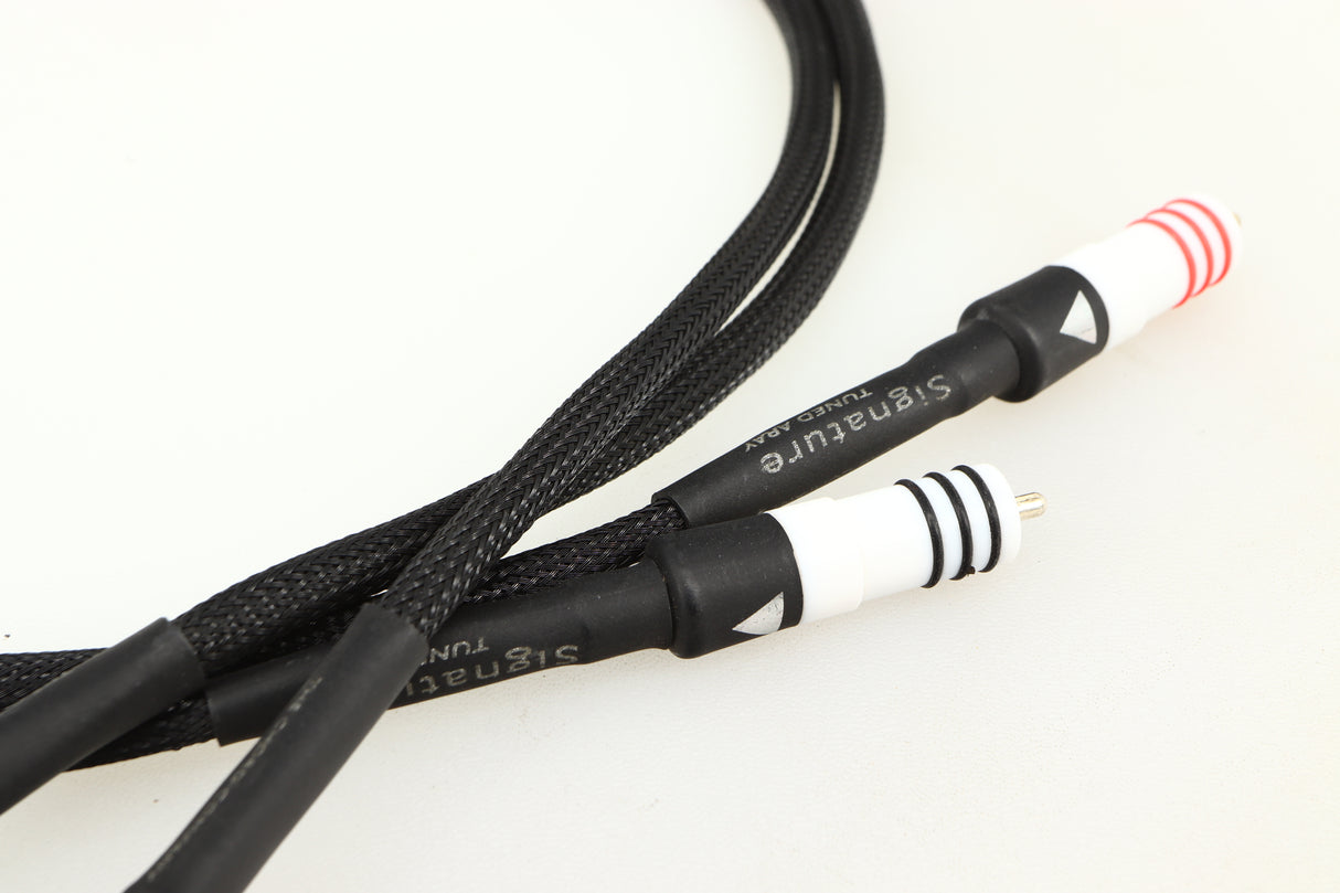 Close up of a used Chord Signature Tuned Aray Interconnect Cable 1.0m RCA-RCA showing connectors