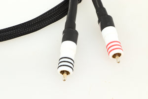 Close up of a used Chord Signature Tuned Aray Interconnect Cable 1.0m RCA-RCA showing connectors
