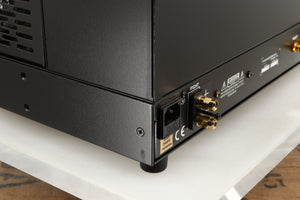 Close up of a used Conrad Johnson MV60SE Power Amplifier showing mark on rear right corner