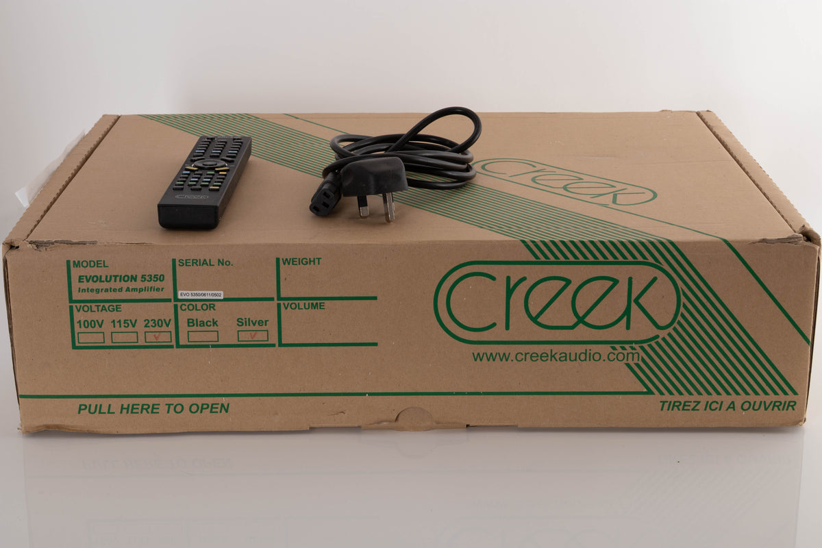 Box of a used Creek 5350 Evolution Integrated Amplifier in Silver with mains cable, and remote