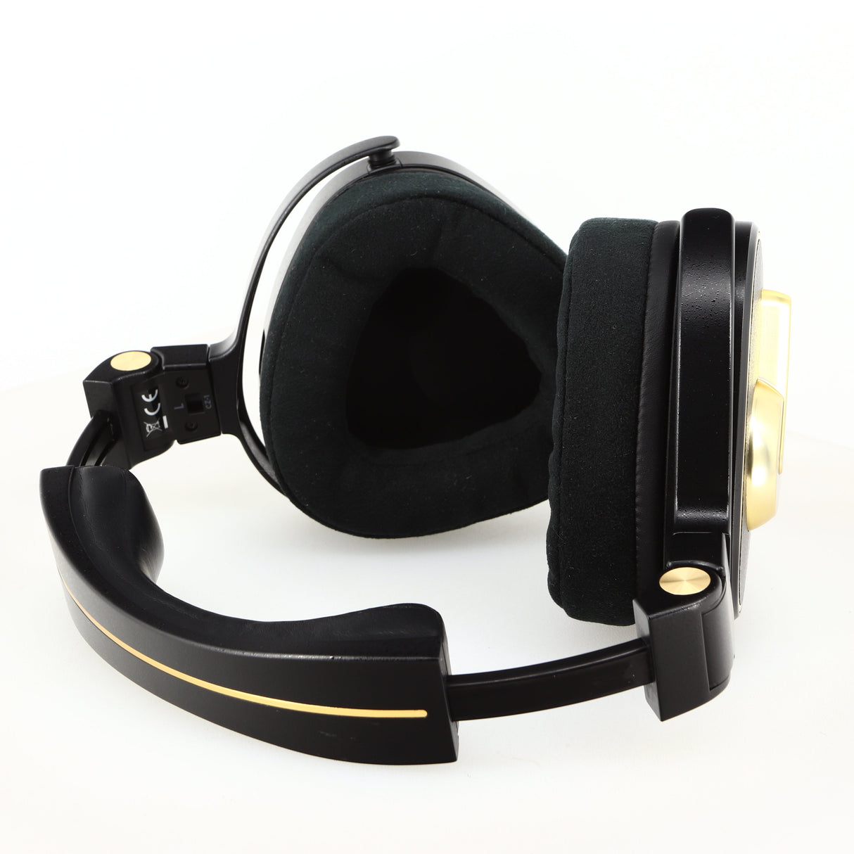 Close up of used Crosszone CZ-1 Headphones in a black / gold finish showing inside of left ear muff