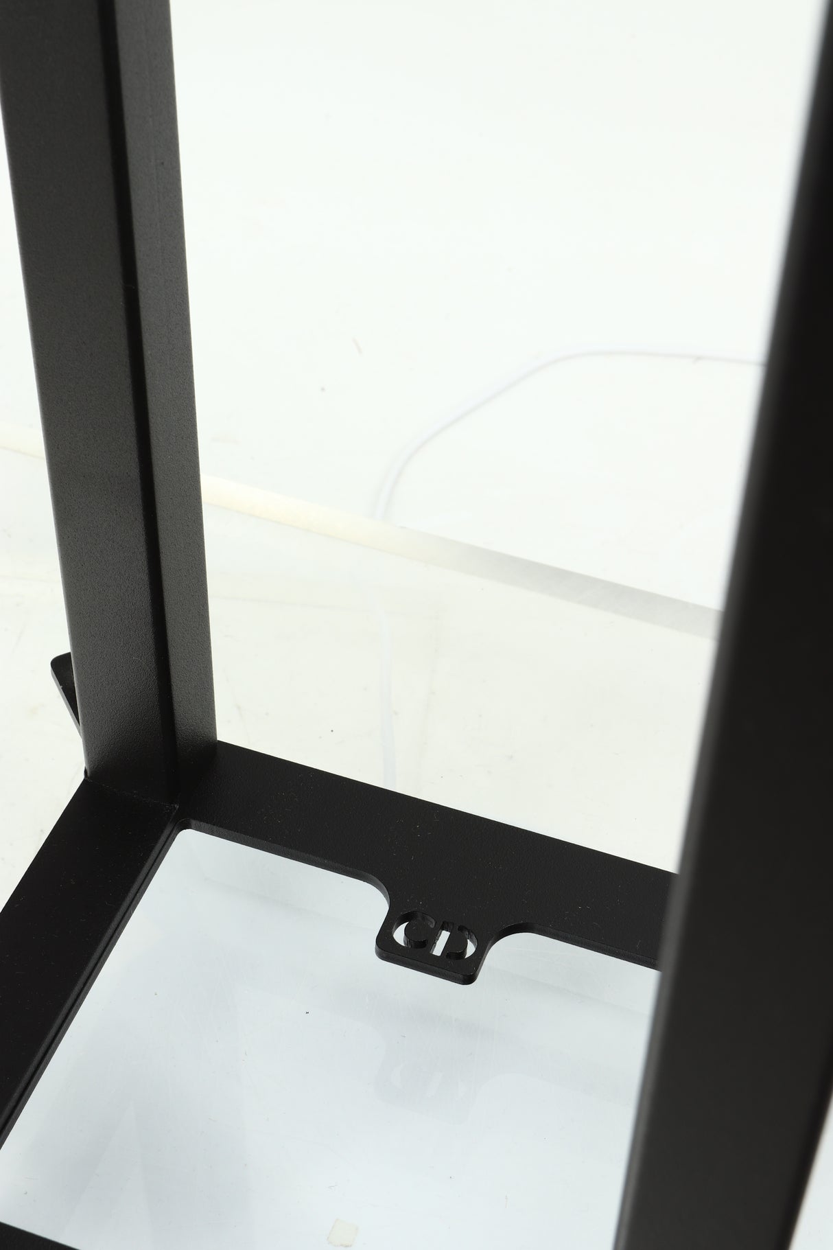 Close up of a used Custom Design QS104 Speaker Stand in a black finish showing the logo