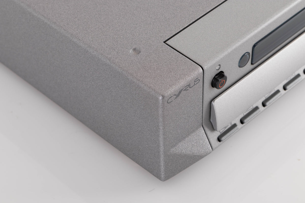 Front left corner of a used Cyrus CD8X CD Player in a Quartz Silver finish