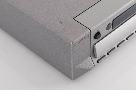 Front left corner of a used Cyrus CD8X CD Player in a Quartz Silver finish