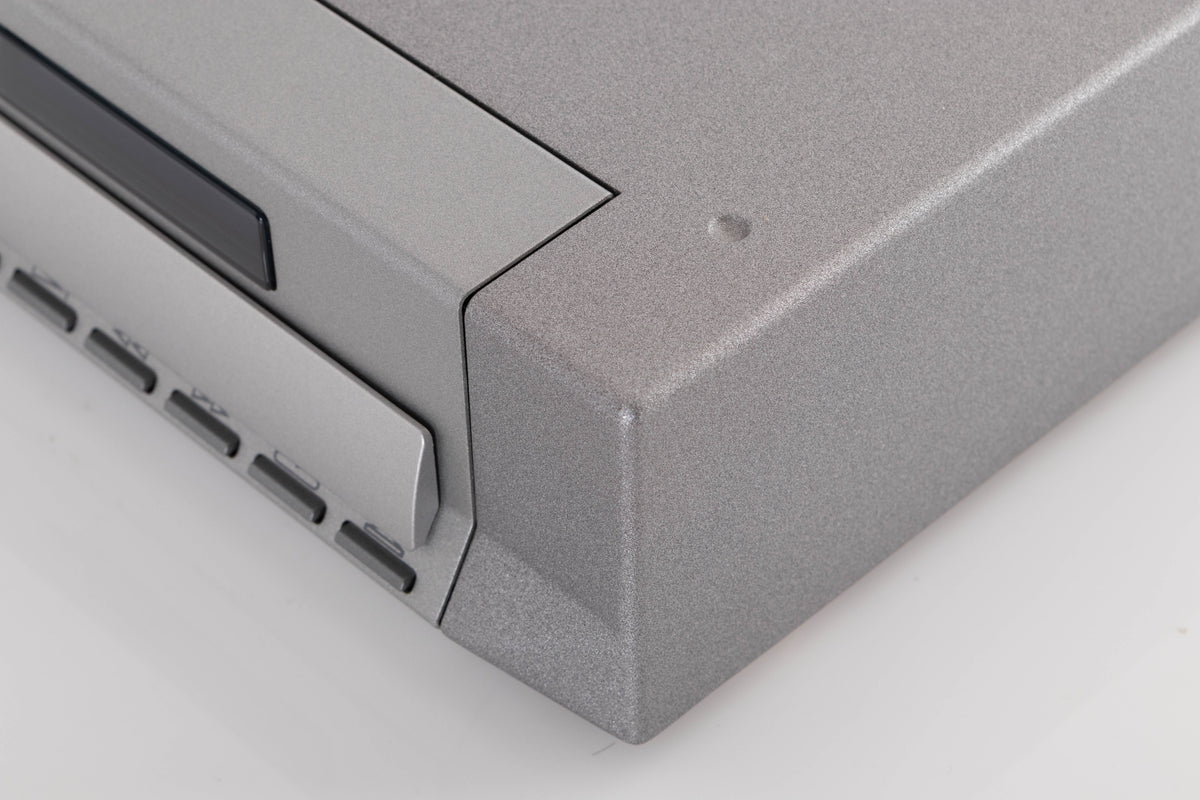 Front right corner of a used Cyrus CD8X CD Player in a Quartz Silver finish