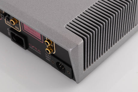 Rear left corner of a used Cyrus CD8X CD Player in a Quartz Silver finish