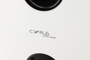 Close up of a used Cyrus ONE Linear Standmount Speaker in a gloss white finish showing logo