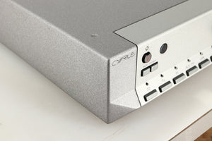 Front left corner of a used Cyrus PRE VS2 Pre Amplifier in a quartz silver finish