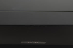 Close up view of a used Cyrus PSU-XR Power Supply in PhBlack finish showing a slight mark on the front edge