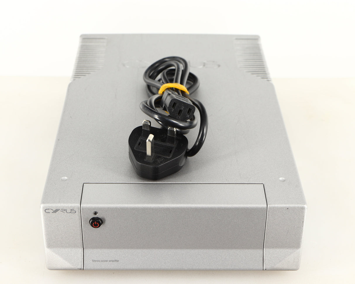 Top of a used Cyrus Q-Power Power Amplifier in a silver finish showing Mains Cable