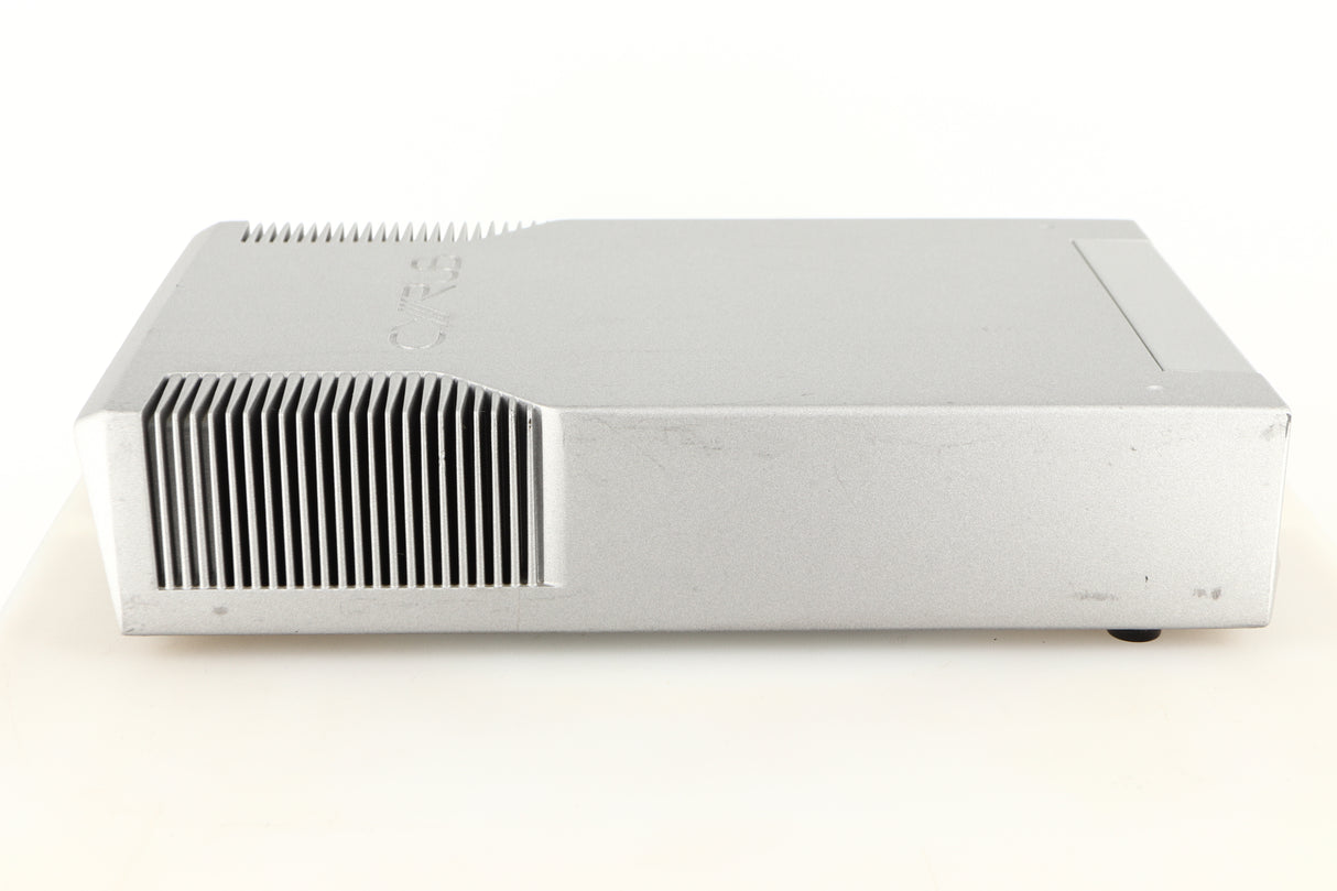 Left side view of a used Cyrus Q-Power Power Amplifier in a silver finish