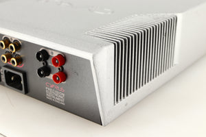 Rear left corner of a used Cyrus Q-Power Power Amplifier in a silver finish