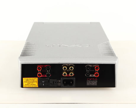 Rear view of a used Cyrus Q-Power Power Amplifier in a silver finish showing Mains Input, Phono Inputs and Speaker Outputs
