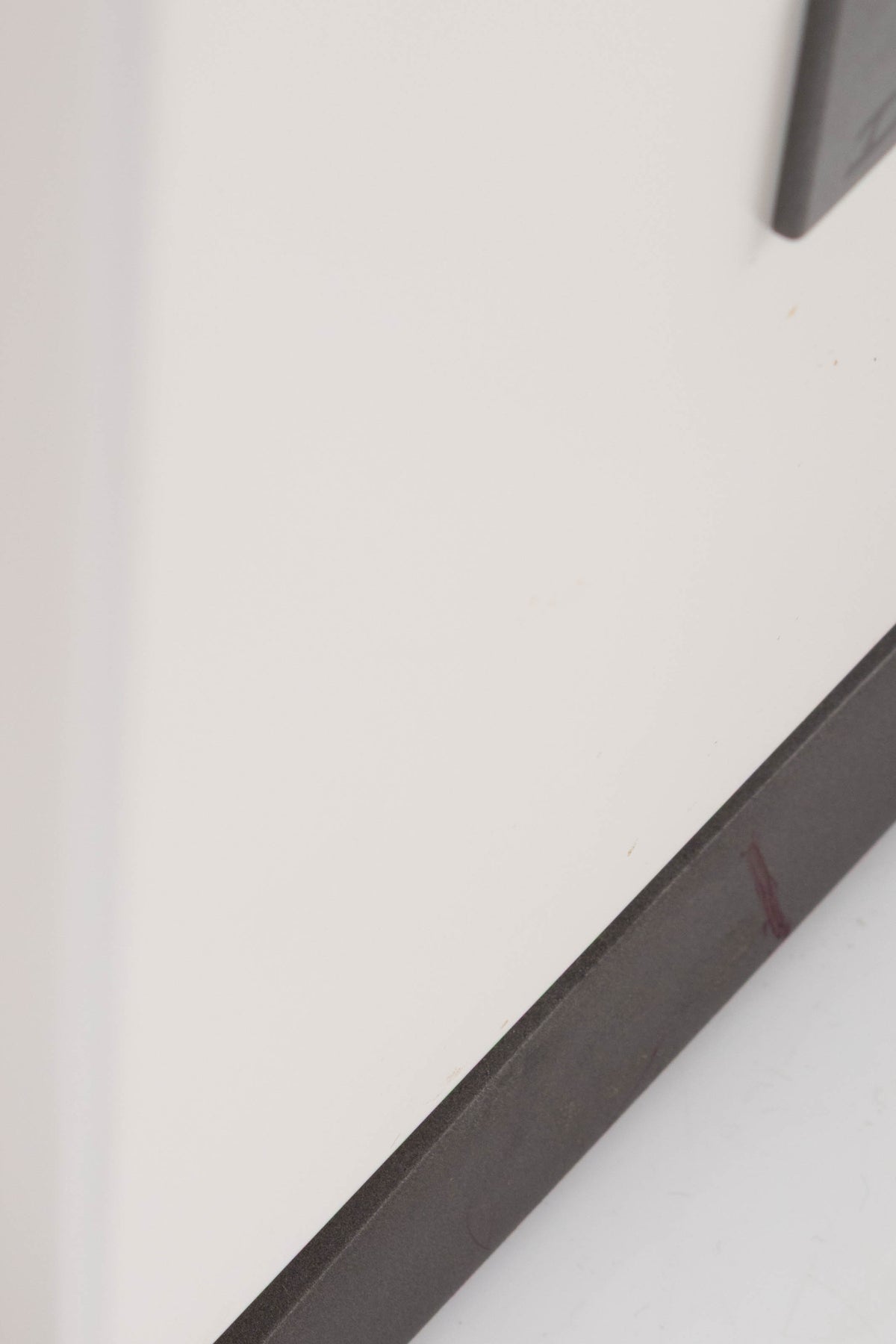 Close up of a used Dali Oberon 5 Floorstanding Speaker in a Light Oak finish showing scratches on base