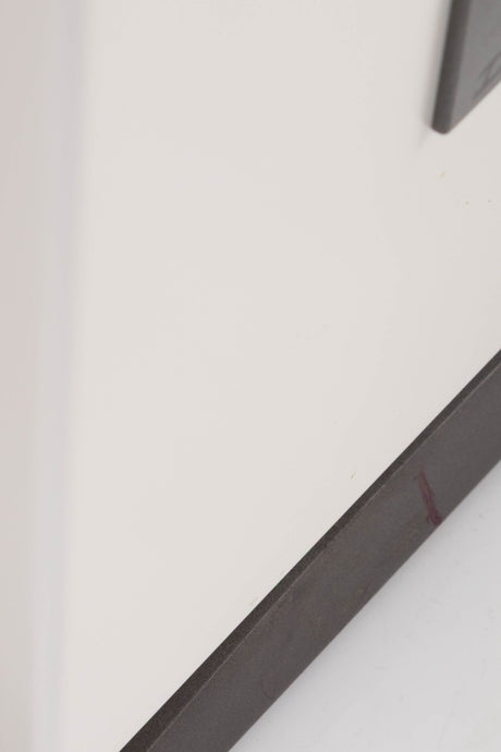 Close up of a used Dali Oberon 5 Floorstanding Speaker in a Light Oak finish showing scratches on base