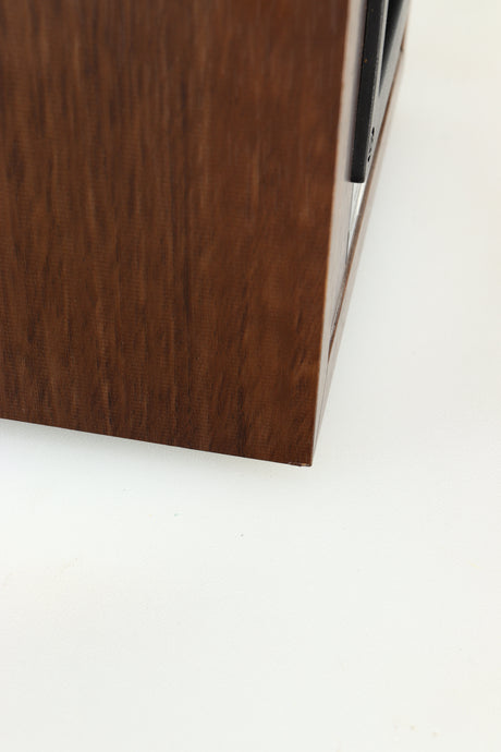 Close up view of a used Dali Spektor 2 Standmount Speaker in Walnut showing some slight damage to the back corner