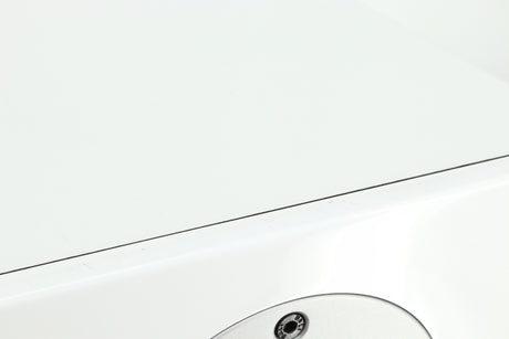 Close up of a used Dali Zensor 3 Standmount Speaker in a satin white finish showing some scratching on the front top edge