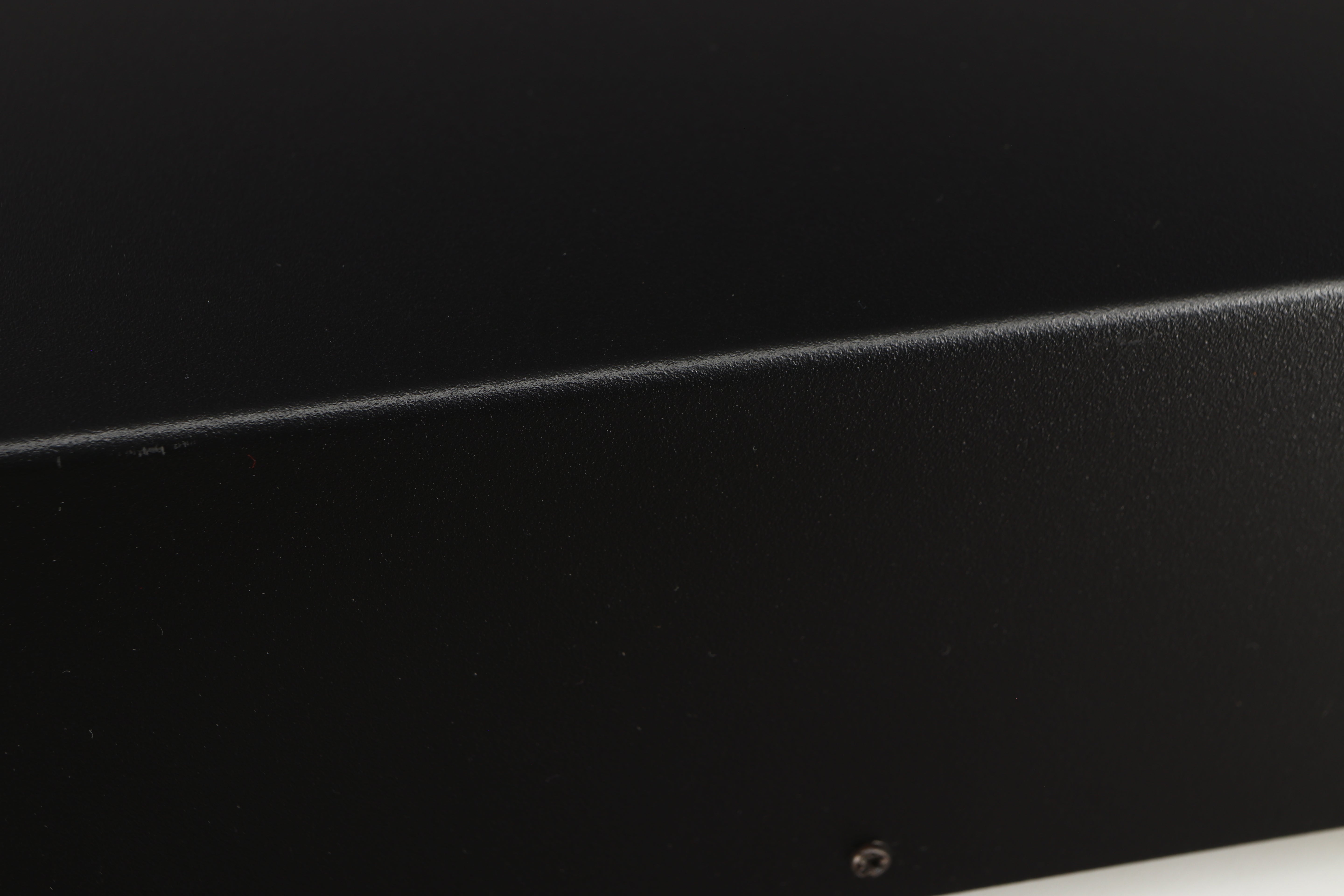 Close up of a used Deco Audio Curve MM Phonostage in a black finish showing scratched on right edge