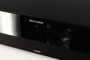 Close up of a used Deco Audio Curve MM Phonostage in a black finish showing light scratches on fascia and fingerprints inside of glass