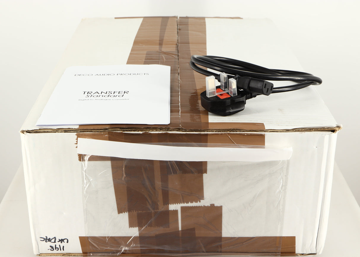 Box for a used Deco Audio Transfer DAC in a black finish showing Manual and Mains Cable