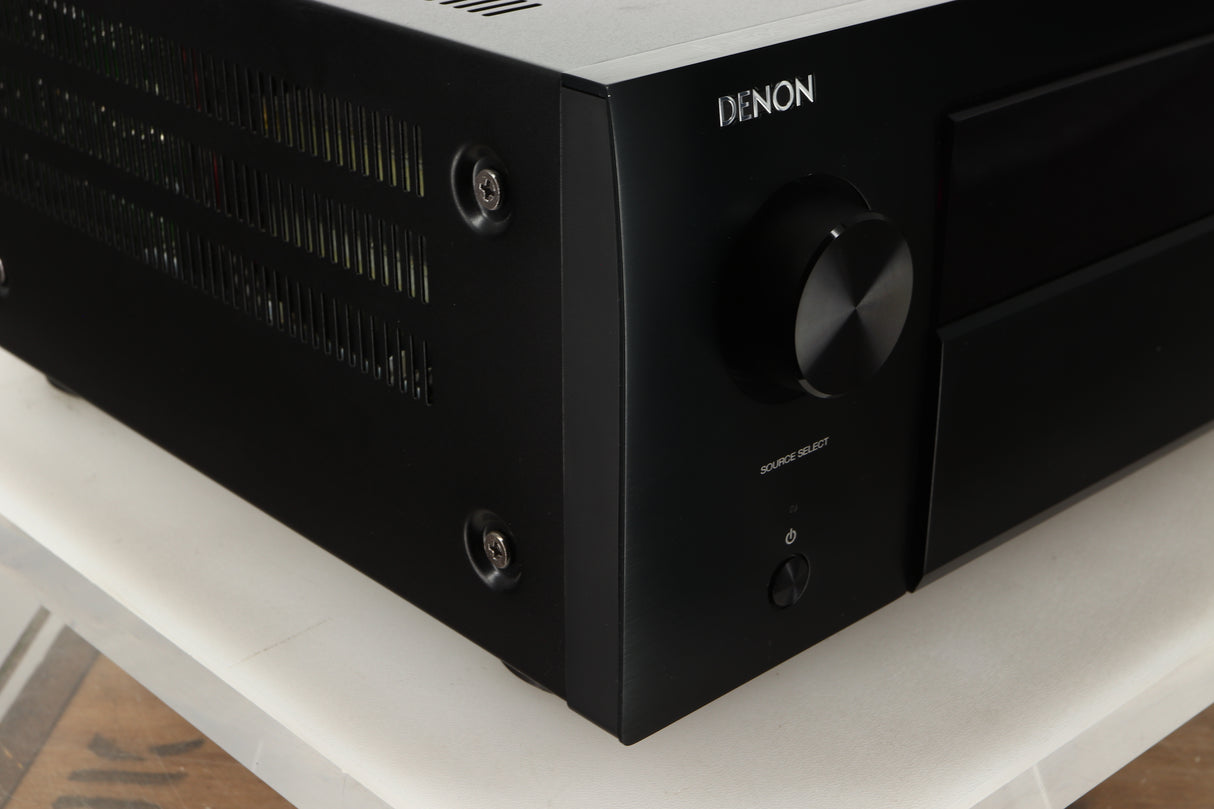 Front left corner view of a used Denon AVR-4700 AV Amplifier in Black finish
