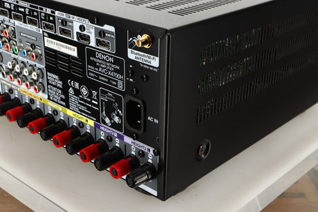 Rear right corner view of a used Denon AVR-4700 AV Amplifier in Black finish