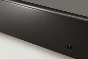 Close up of a used Denon DDR-6.5 Cassette Deck in a silver finish showing some scratches on left side