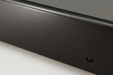 Close up of a used Denon DDR-6.5 Cassette Deck in a silver finish showing some scratches on left side