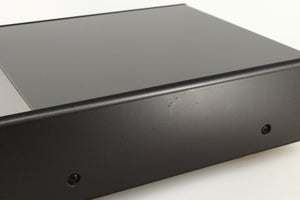 Close up of a used Denon DDR-6.5 Cassette Deck in a silver finish showing some scratches on right side