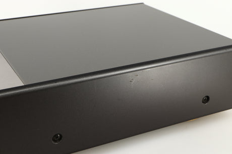 Close up of a used Denon DDR-6.5 Cassette Deck in a silver finish showing some scratches on right side