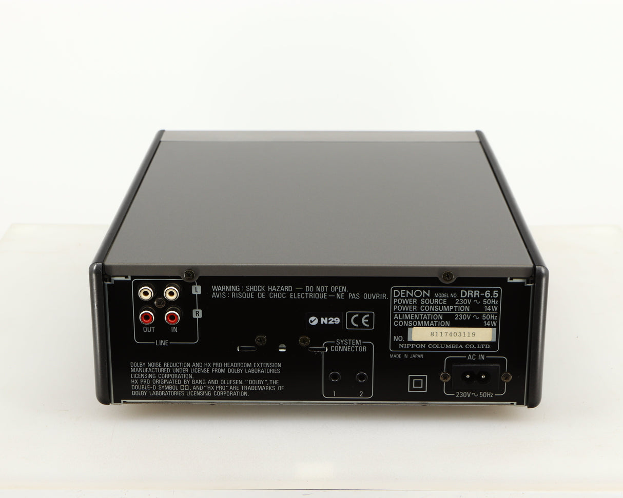 Rear view of a used Denon DDR-6.5 Cassette Deck in a silver finish showing Phono Inputs, Phono Outputs and Power Input
