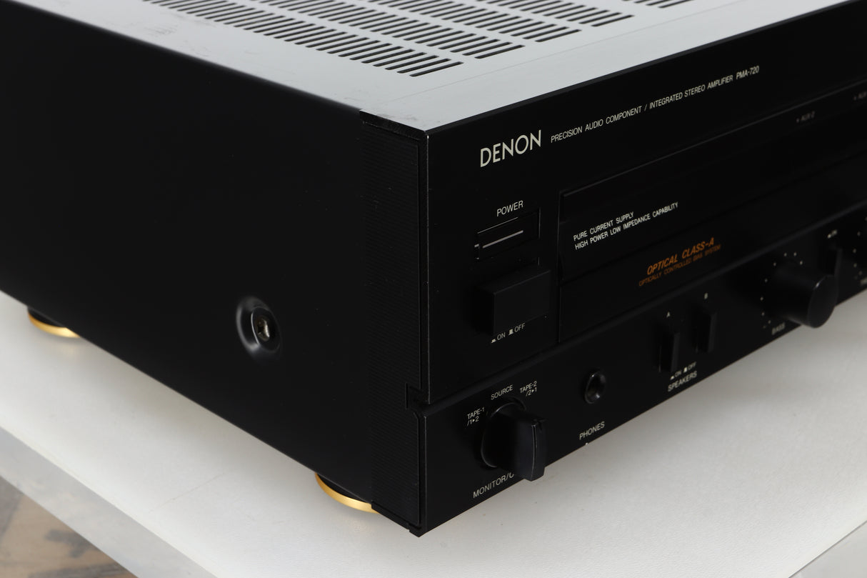 Front left corner view of a used Denon PMA-720 Integrated Amplifier in Black finish 