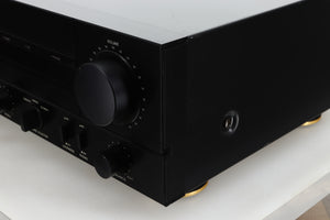 Front right corner view of a used Denon PMA-720 Integrated Amplifier in Black finish 