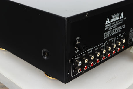Rear left corner view of a used Denon PMA-720 Integrated Amplifier in Black finish 