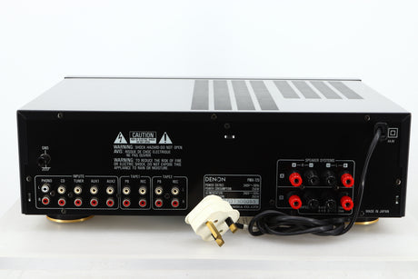 Rear view of a used Denon PMA-720 Integrated Amplifier in Black finish showing RCA inputs, and speaker outputs 