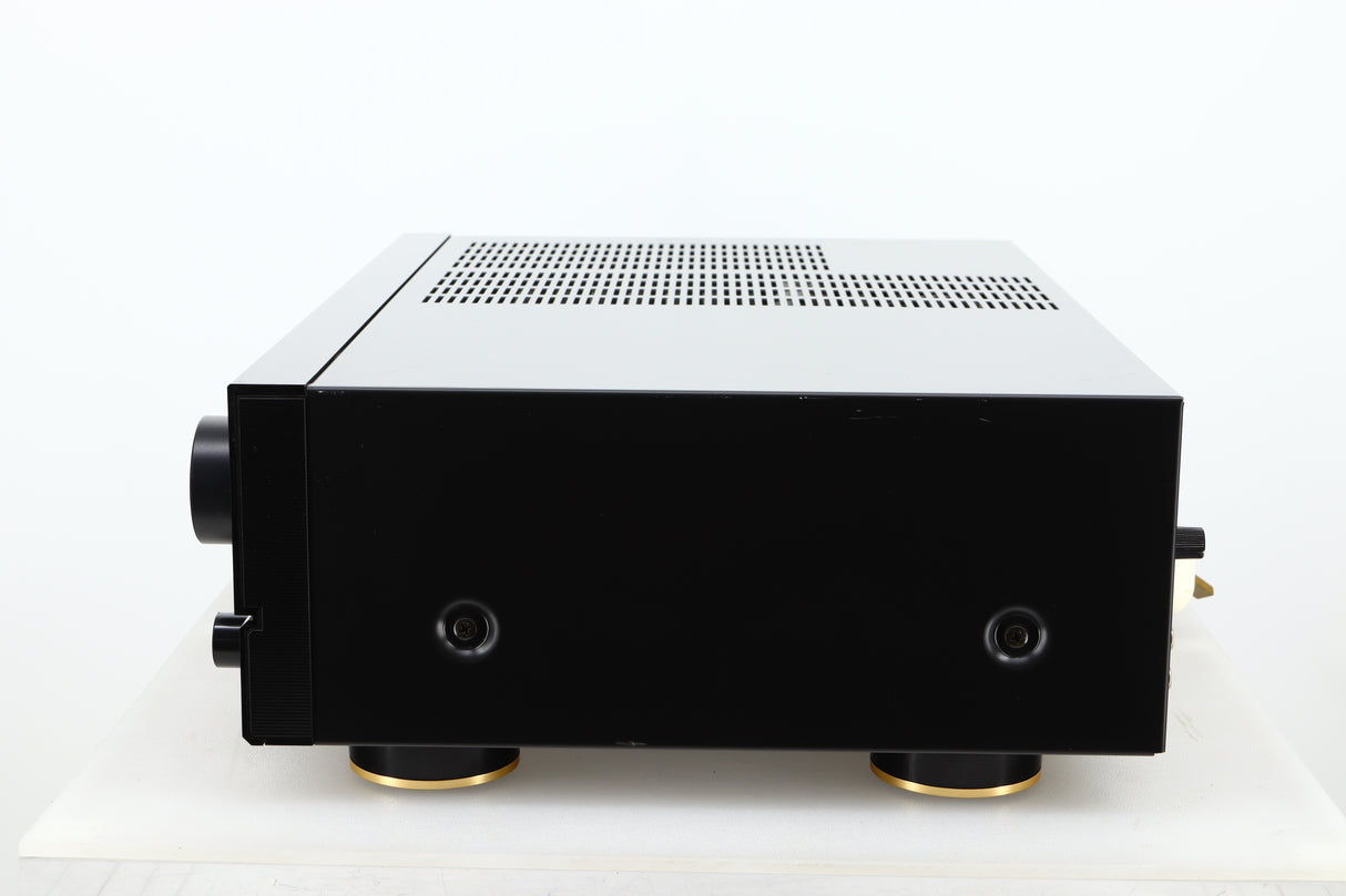 Side view of a used Denon PMA-720 Integrated Amplifier in Black finish 