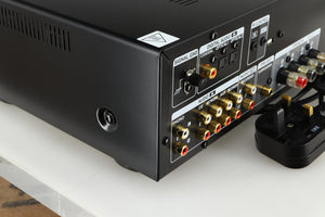Rear right corner of a used Denon PMA600 Integrated Amplifier in a black finish