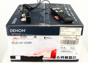 Box for a used Denon RCD-N10 Network CD Receiver in a black finish showing Remote, 2x Batteries and Power Cable