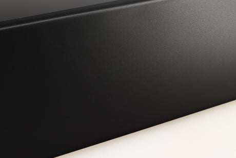 Close up of a used Denon RCD-N10 Network CD Receiver in a black finish showing light scratches on left side