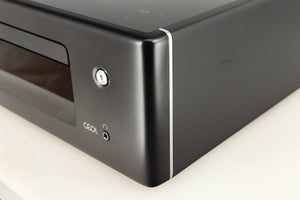 Front right corner of a used Denon RCD-N10 Network CD Receiver in a black finish