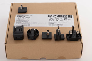 Box for a used Denon SPK618 HDMI Adaptor in a Black finish showing PSU, Mains Plug and Schuko Plug