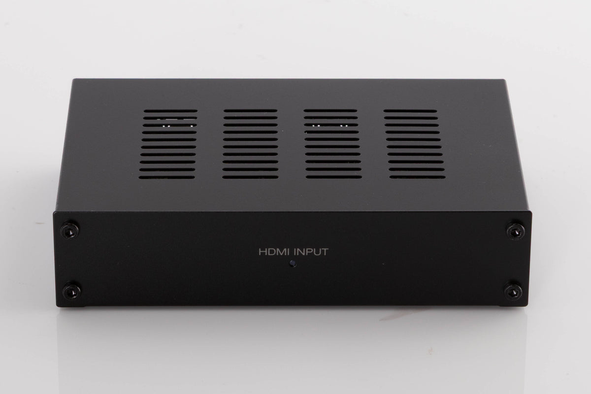 Front view of a used Denon SPK618 HDMI Adaptor in a Black finish