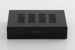 Front view of a used Denon SPK618 HDMI Adaptor in a Black finish