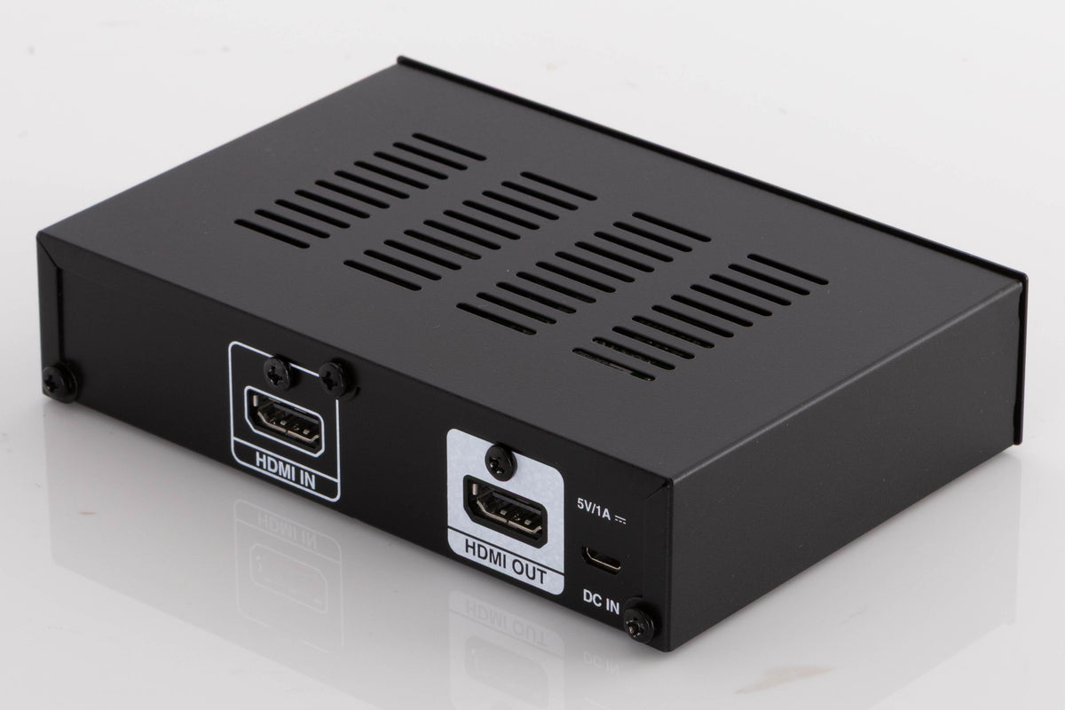 Rear left corner of a used Denon SPK618 HDMI Adaptor in a Black finish