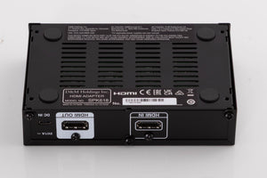 Underside of a used Denon SPK618 HDMI Adaptor in a Black finish