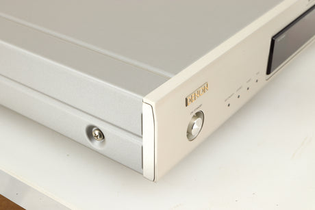Front left corner of a used Denon TU-1800 DAB/FM Tuner in a silver finish 