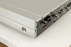 Rear right corner of a used Denon TU-1800 DAB/FM Tuner in a silver finish 
