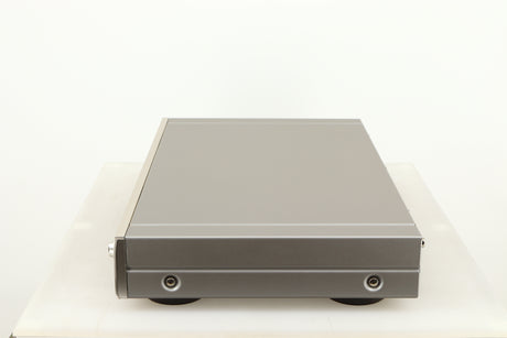 Right side view of a used Denon TU-1800 DAB/FM Tuner in a silver finish 