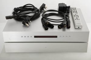 Front view of a Densen 275 Pre Amplifier with 2NRG PSU, Mains cables, 3x XLR cables, and remote PSU